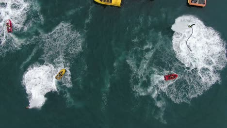 team demonstrating a flyboard on the sea