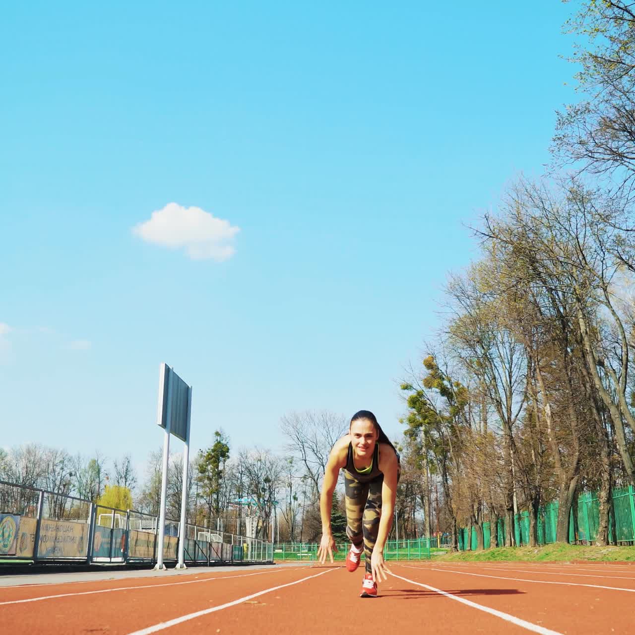 Sport reaction video Athletes at starting position preparing for run at the stadium. Healthy fitness lifestyle