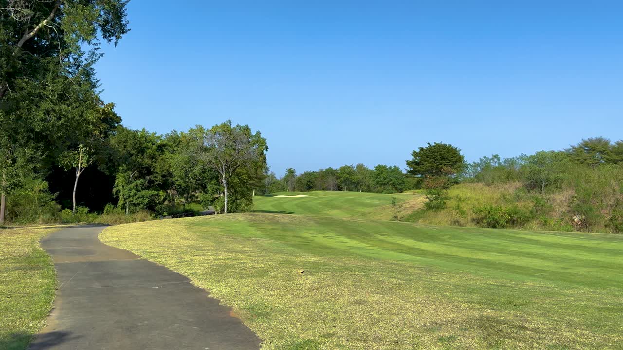 A serene golf course with lush greenery