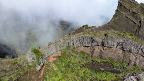 Tourists-In-The-Mountains-Of-Madeira-At-Pico-do-Arieiro-In-Portugal---aerial-drone-shot