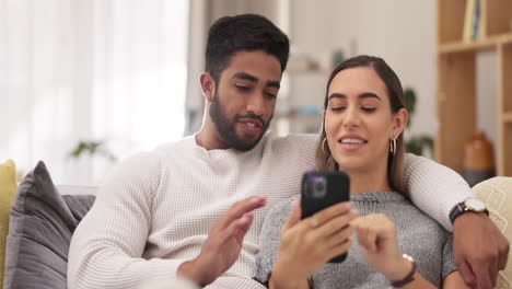 Phone,-relax-and-couple-on-sofa-in-home