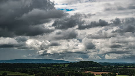 a time lapse of clouds on a windy day looking over the countryside towards bredon hill in the cotswolds, uk