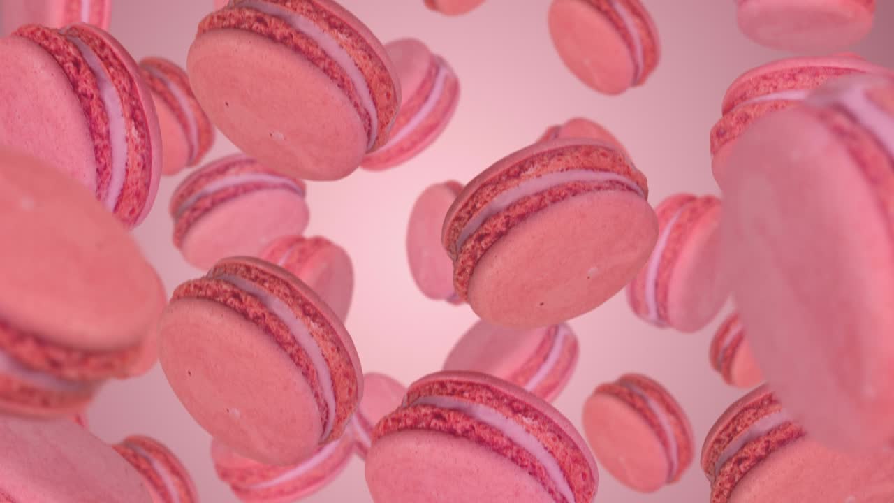 Pink macarons  falling down. Slow motion