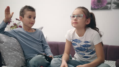 siblings give five hand on video gaming. kids fun together at home