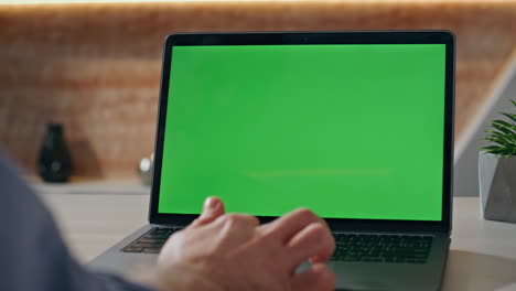 man hands swiping chromakey laptop morning office table closeup. creator working