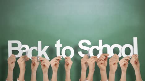 Hands-holding-up-back-to-school