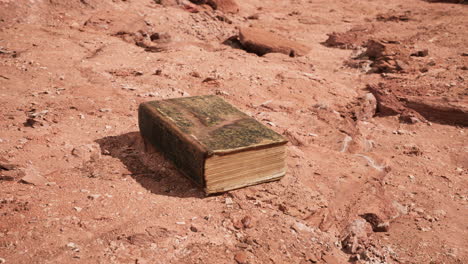 old book in red rock desert