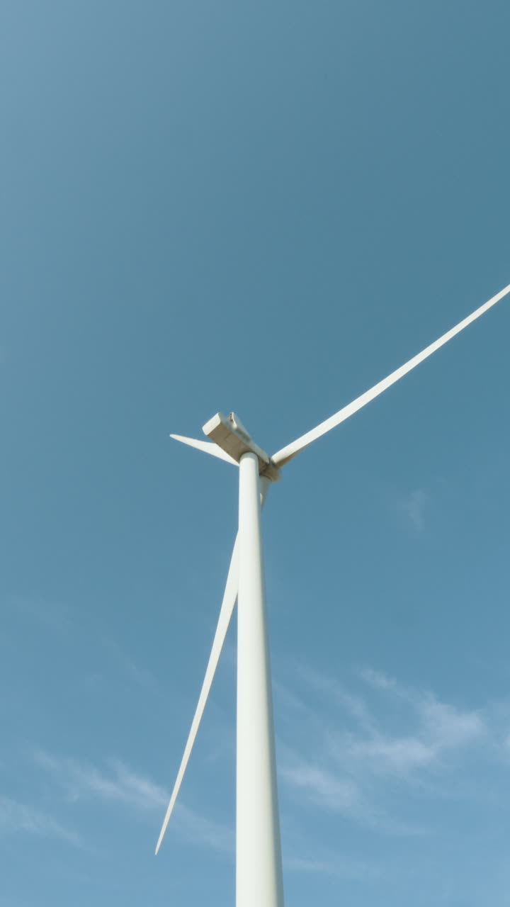 Wind turbine against blue sky