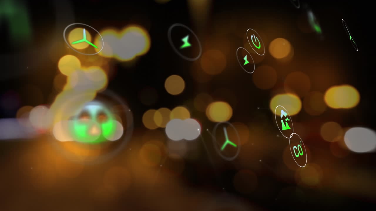 Animation of multiple digital icons against blurred view of night city traffic