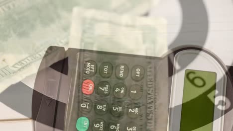 animation of credit card payment terminal, over dollar bills on rotating target