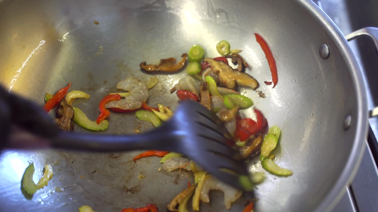 Stir-frying Shrimp, Vegetables, and Mushrooms in a Wok