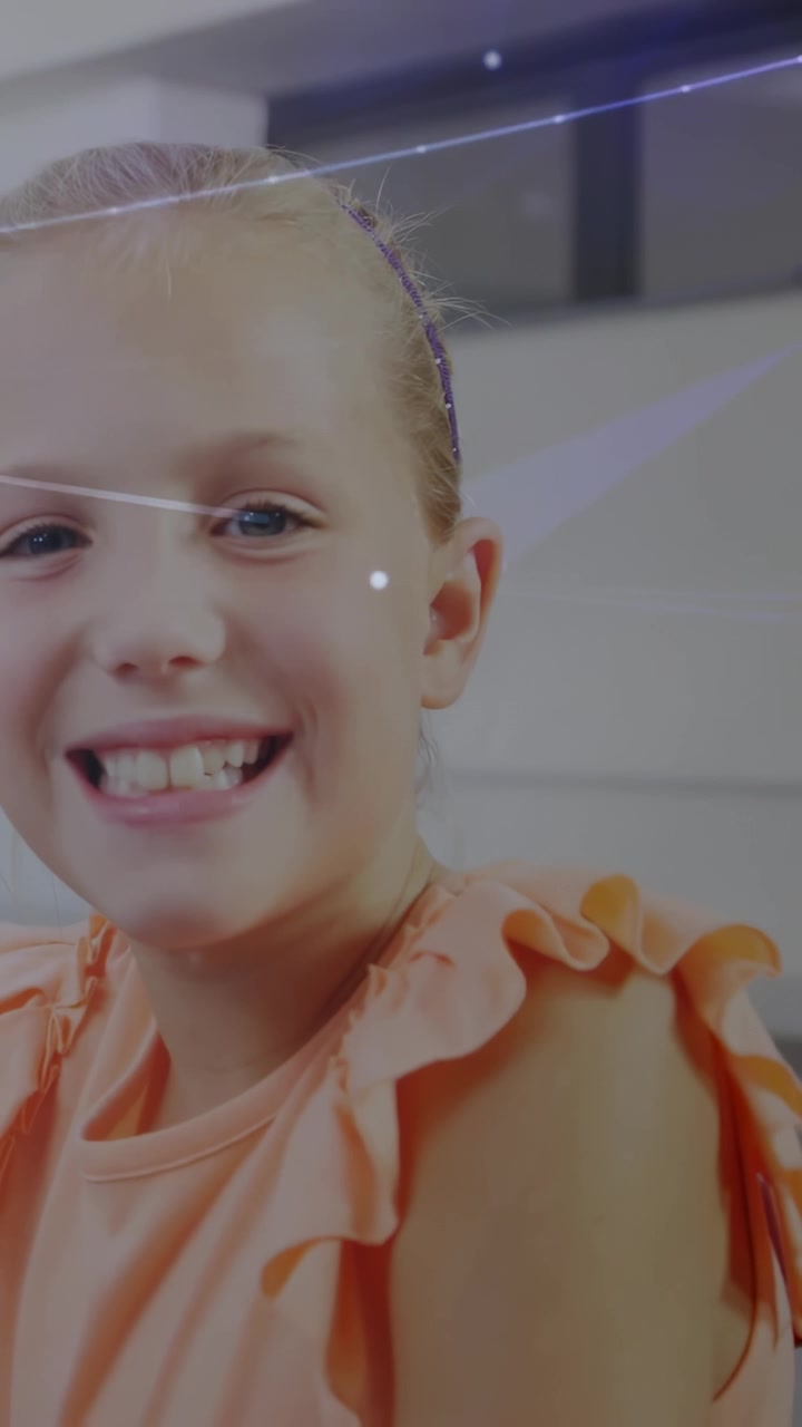 Vertical video: Girl smiling and tilting head as filming starts, sparkles crossing face for content