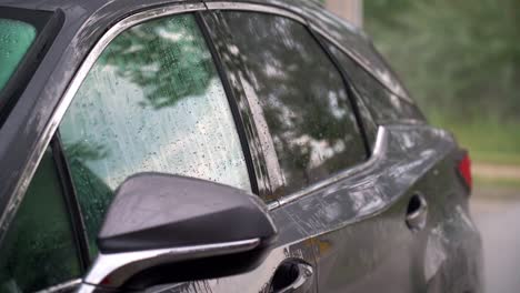 water droplets on car windows during manual washing