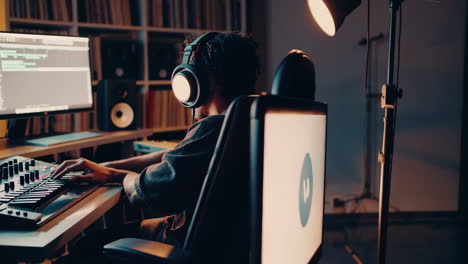 music producer in home recording studio