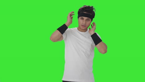 indian man doing neck exercise green screen