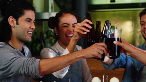 Friends-toasting-drinks-in-restaurant