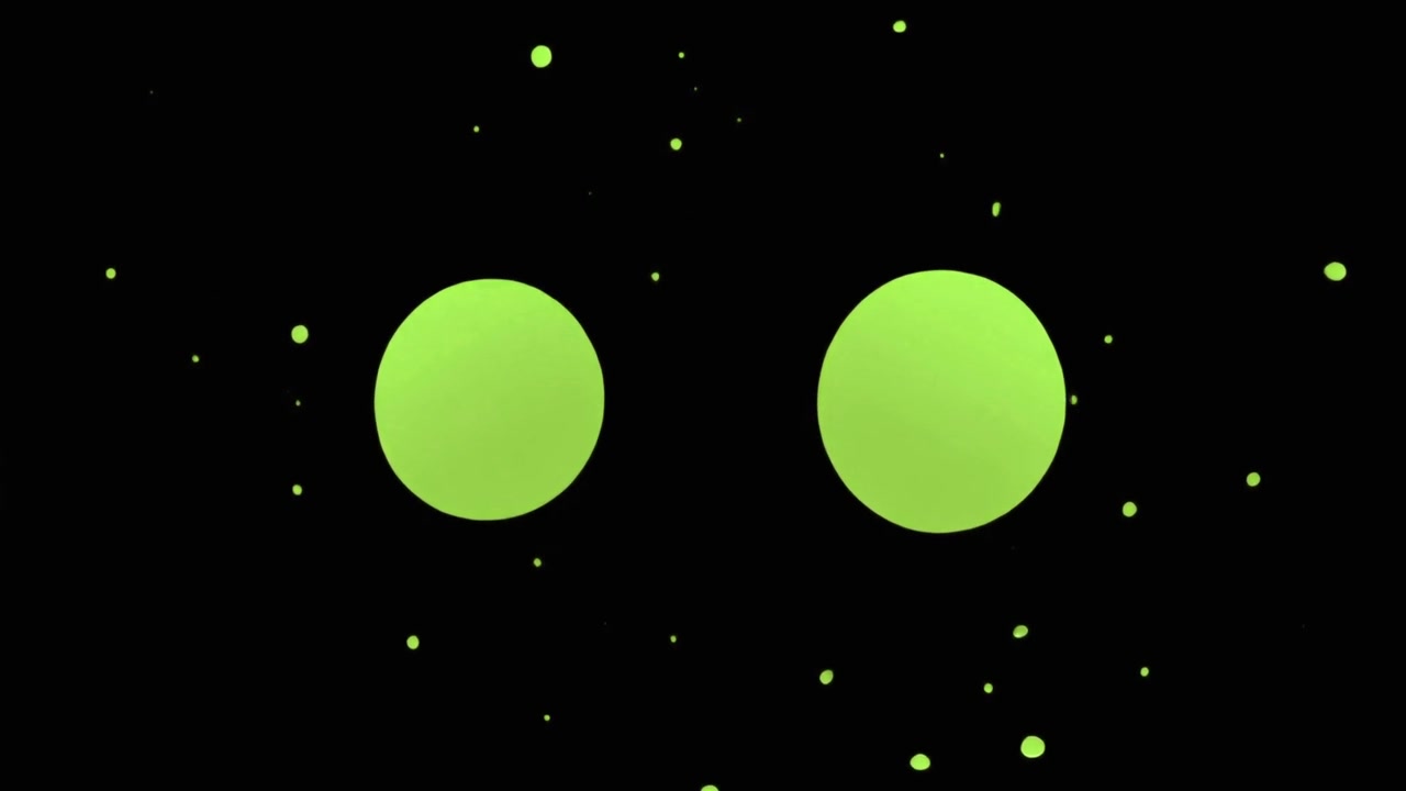 Schizzo di liquido verde che si trasforma in due cerchi perfetti