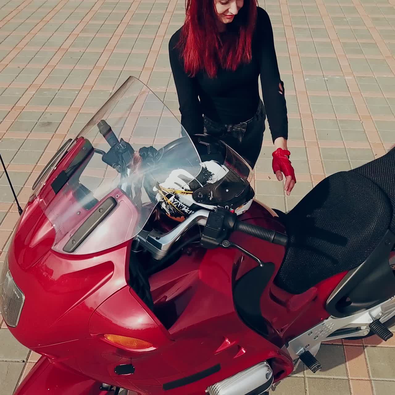 Woman sitting on motorcycle