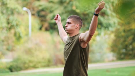 Athletic-man-loosens-his-arms-and-muscles-in-preparation-for-his-training-workout