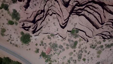 aerial drone view over the dramatic red rock formations of the calchaquí valleys in argentina