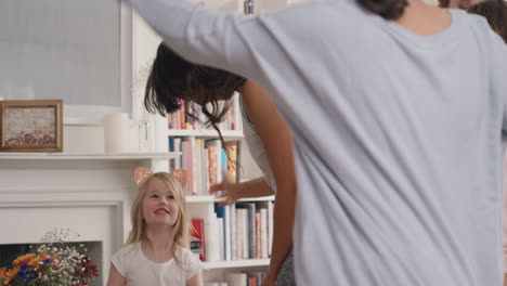 funny-family-dancing-at-home-having-fun-enjoying-dance-celebrating-exciting-weekend-together-wearing-pajamas