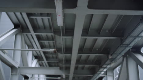 Metal-bridge-at-construction-site.-Dolly-shot-of-trestle-bridge-in-details