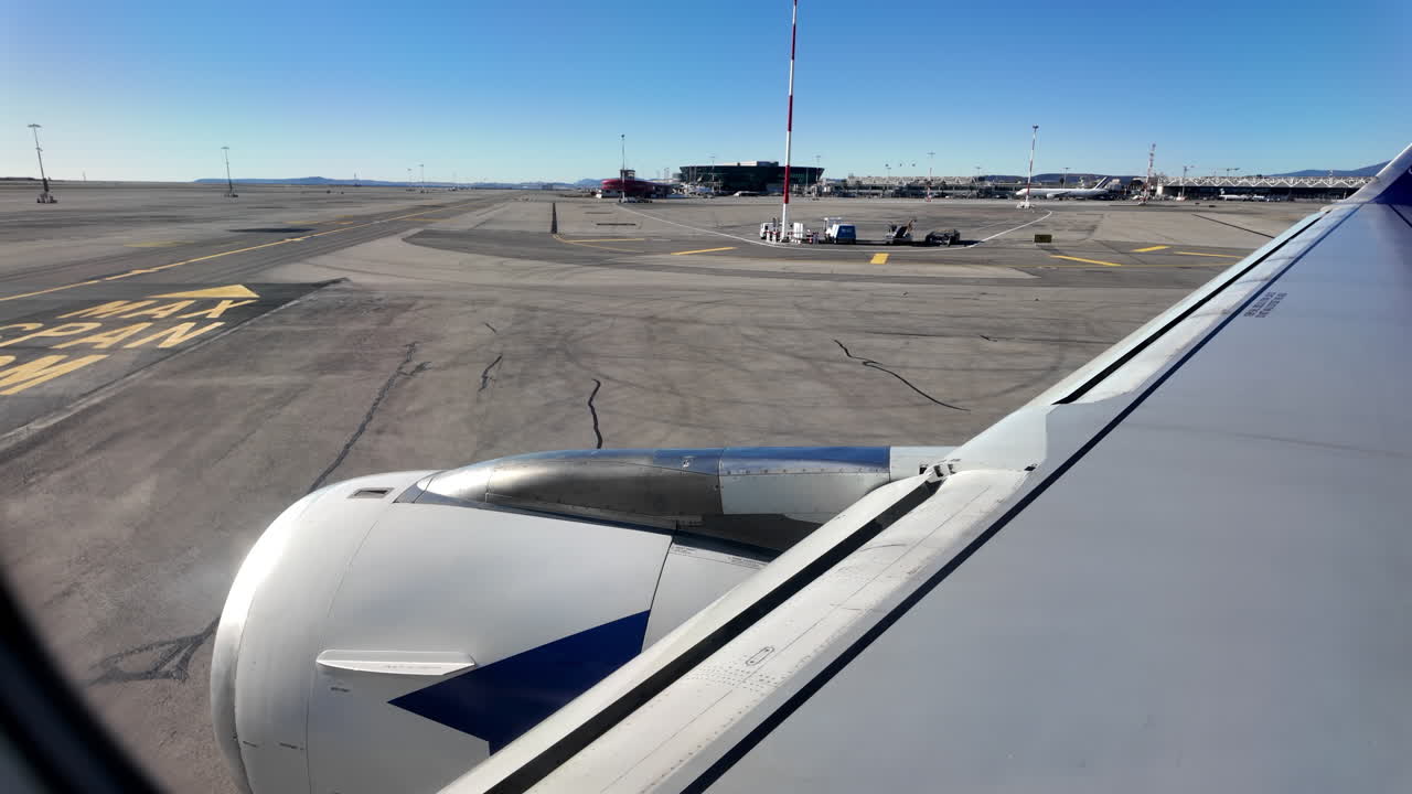 Nice, France - March 20, 2025: View from an airplane window of an airplane moving through the airport before departure