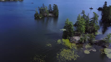 Rocky-islands-with-green-trees-on-Big-Bald-Lake-in-cottage-country-Trent,-Ontario