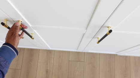 white cabinets with black and gold handles