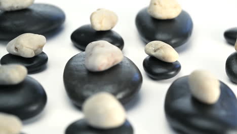 black and white pebbles turning