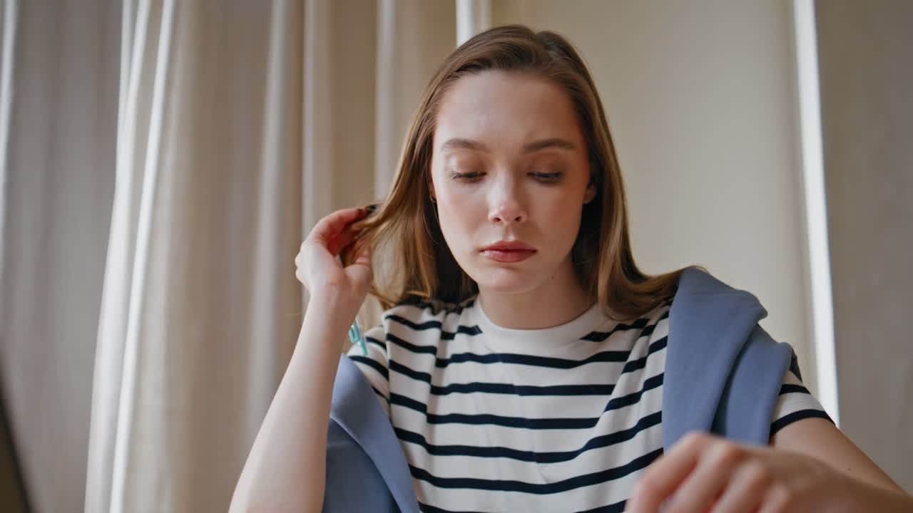 Thoughtful writer pondering idea at home desk closeup. Serious woman student