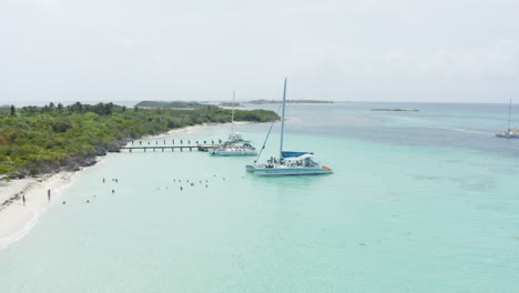 tourist boat on tropical island beach of cayo icacos, puerto rico - aerial