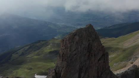 Flying-towards-mountain-top-with-a-Gipfelkreuz-or-summit-cross-on-top