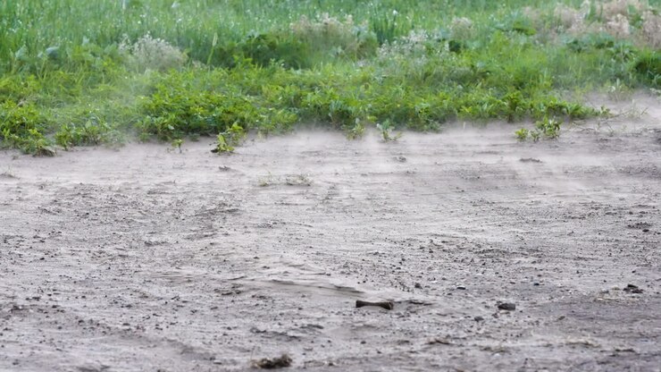 Dust swirling and blowing across the ground
