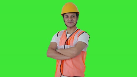 Portrait-of-Happy-Indian-labour-standing-crossed-hands-Green-screen