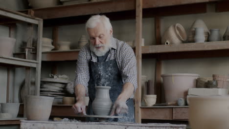 senior potter at work in a workshop