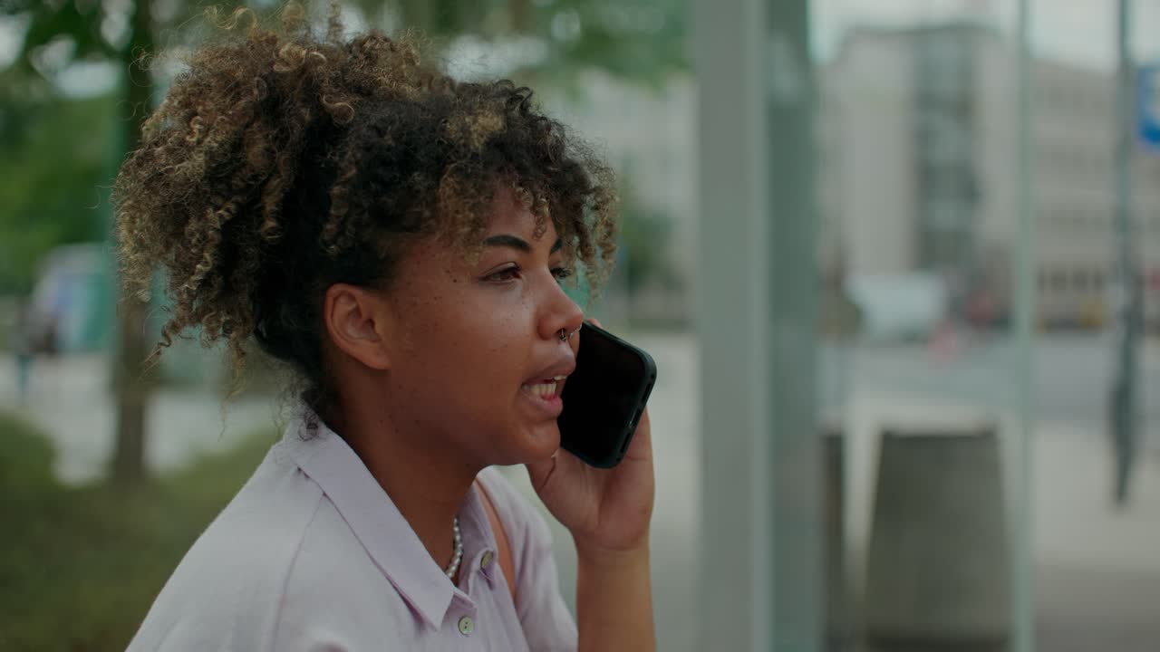 Woman Talking on Phone in City