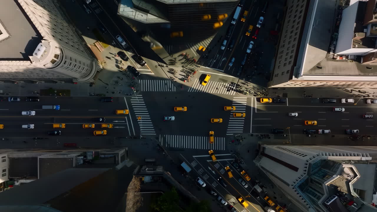 Aerial View of a Busy City Intersection with Traffic and Pedestrians