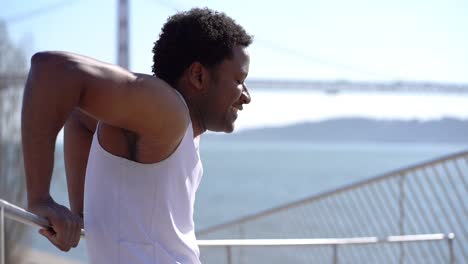 smiling african american man exercising outdoor