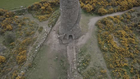 The-Ruin-Of-The-Flue-Chimney-At-Ballycorus-Leadmines-In-Carrickgollogan-Park-Near-Dublin-City-In-Ireland---aerial-drone-shot