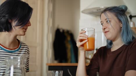 tracking video of two women talking during breakfast.