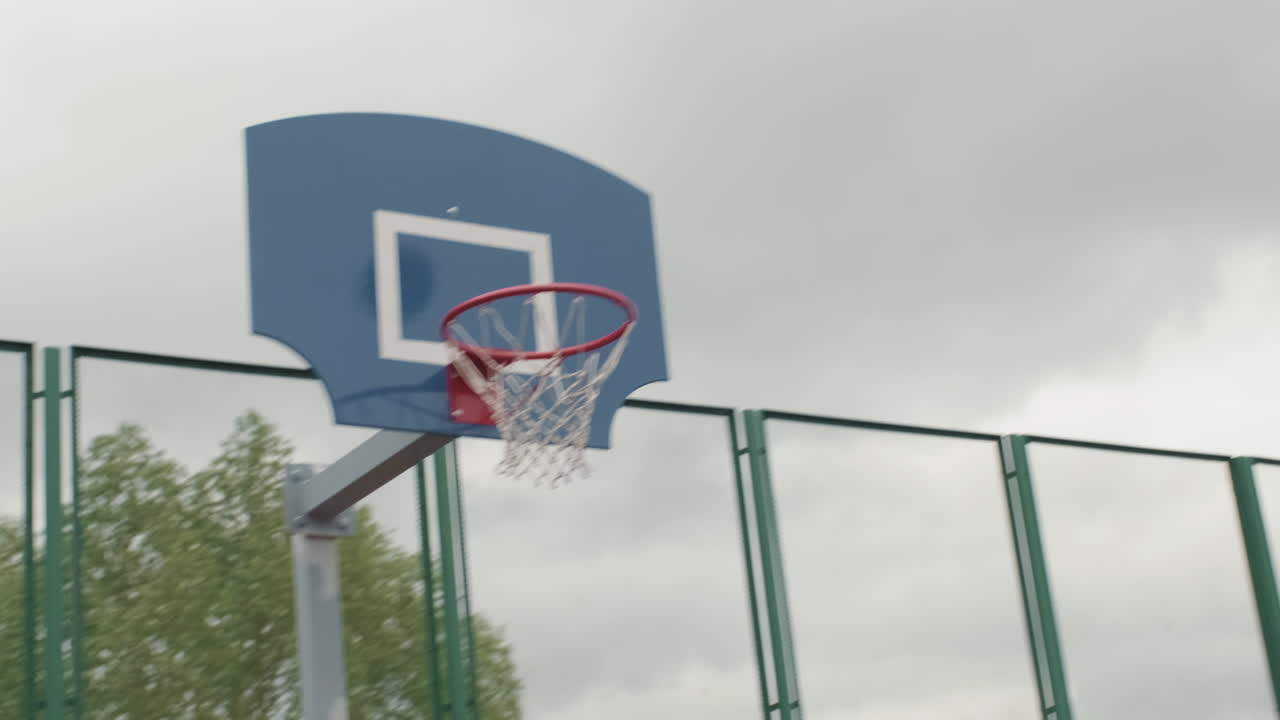 Man Making Basket during Streetball Game