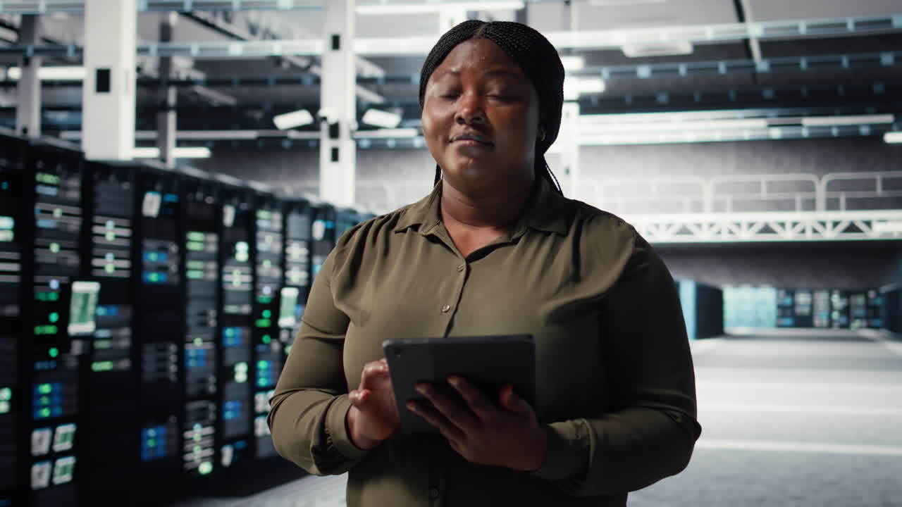 Data center programmer monitors data center metrics on tablet