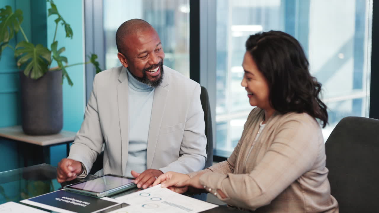 Happy Business Colleagues High-Fiving During a Successful Office Meeting