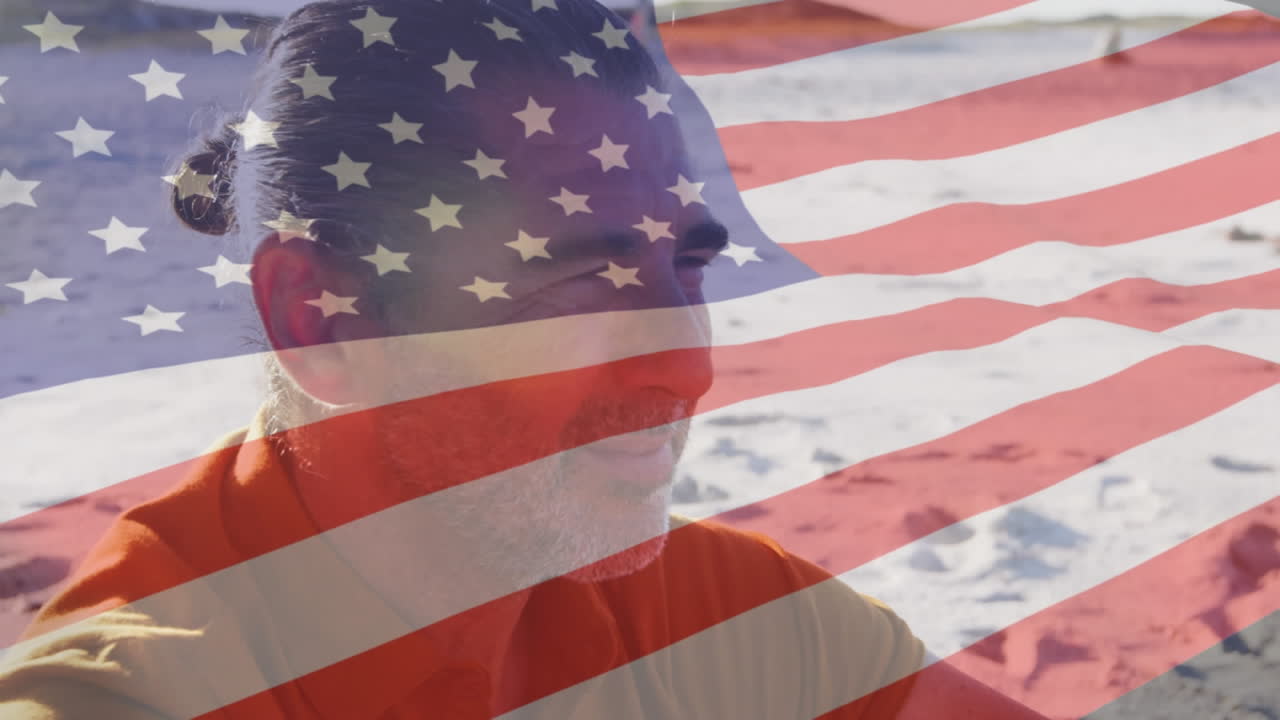 animación de la bandera estadounidense ondeando sobre el hombre mayor en la playa
