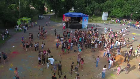 happy people celebrating color festival. vinnitsa, ukraine - july 2017: happy young people celebrating during music and colors festival