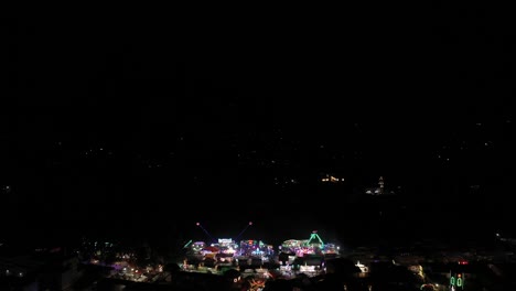 Aerial-colorful-firework-display-at-night-over-festival-light-up-in-sky