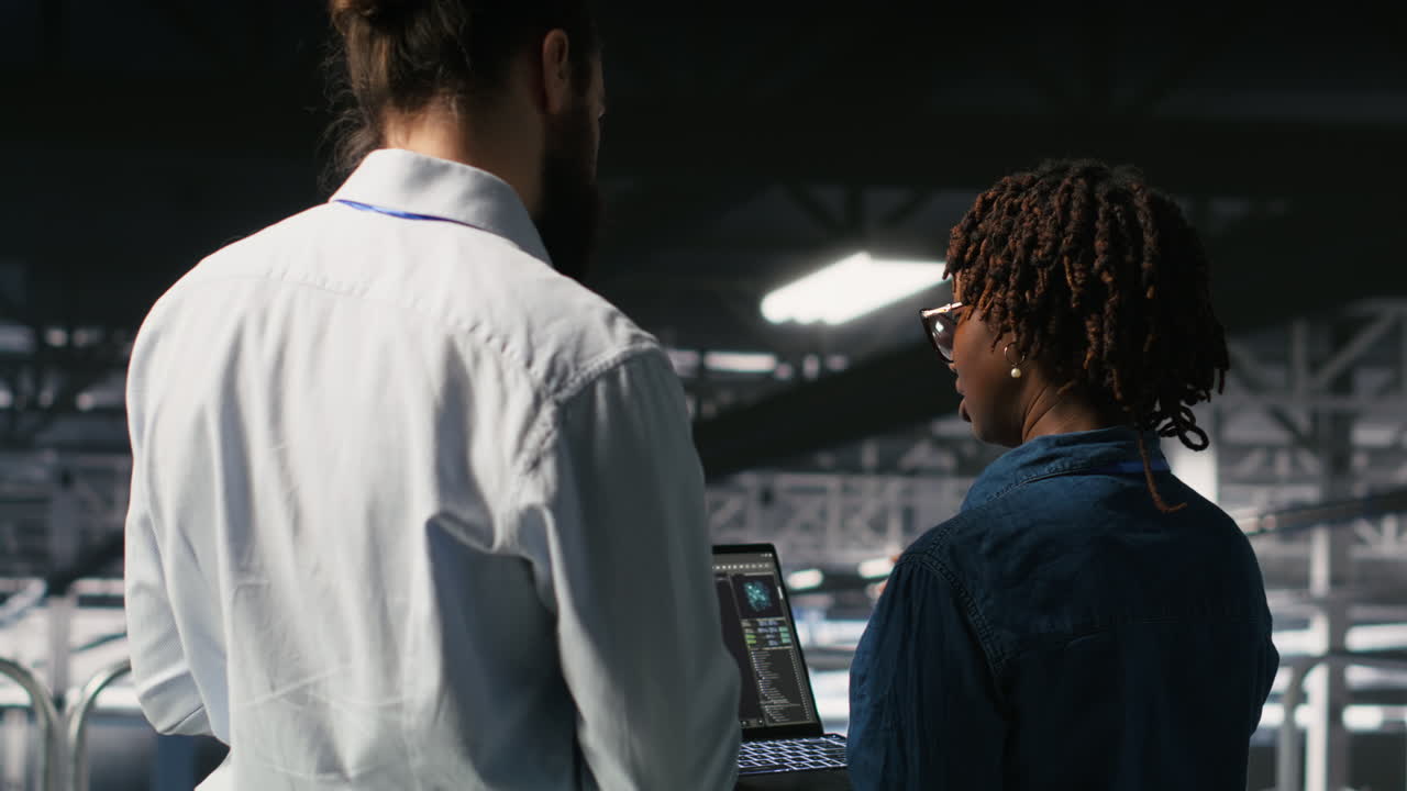 Data center manager overseeing work done by admin using AI LLM visualization