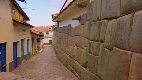 close up reveal shot of cobblestone streets in cusco, peru. famous twelve-angled stone street, tourism hotspot