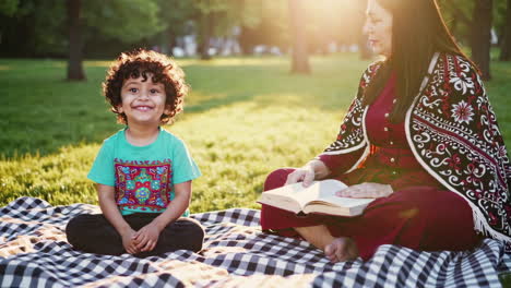 mother and son enjoying a picnic in the park